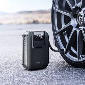 Spark hand portable air pump inflating a car tire with digital pressure display